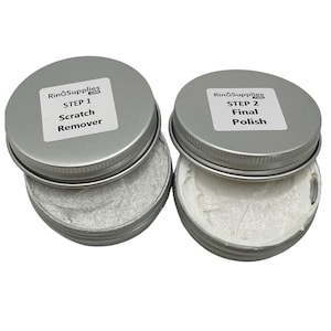 May include: Two small silver tins with white lids. The lids are labeled with the text "RingSupplies.com". The left tin is labeled "STEP 1 Scratch Remover" and the right tin is labeled "STEP 2 Final Polish".