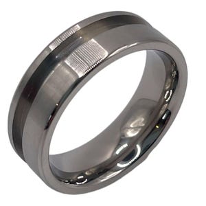May include: A silver ring with a black inlay. The ring has a brushed finish and a beveled edge.