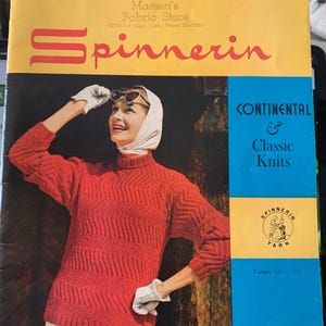 May include: A vintage magazine cover with a woman wearing a red sweater, white gloves, and a headscarf. The cover features the text "Revised Edition" and "Spinnerin" in red, with a blue section that reads "Continental & Classic Knits."