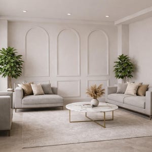 May include: A modern living room with light gray sofas, decorative pillows, and a marble-topped coffee table with a gold base. The room features a neutral color palette, a large rug, and decorative plants, creating a serene atmosphere.