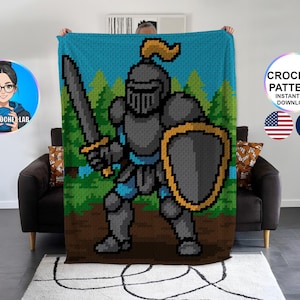 May include: A pixelated crochet blanket featuring a knight in full armor, holding a sword and shield. The design includes a blue sky and green trees in the background. The blanket is displayed against a neutral background.