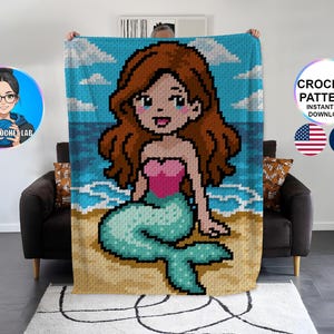 May include: A pixelated crochet blanket featuring a mermaid on a beach with a blue sky and ocean background. The mermaid has brown hair, a pink top, and a turquoise tail. The blanket is held up by a person. Text on the blanket reads "CROCHET PATTERN INSTANT PDF DOWNLOAD".