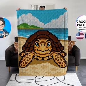 May include: A crochet blanket with a pixelated design of a sea turtle on a beach. The turtle is brown with blue eyes, set against a tan beach, blue sea, and sky. Text reads "CROCHET PATTERN INSTANT PDF DOWNLOAD".
