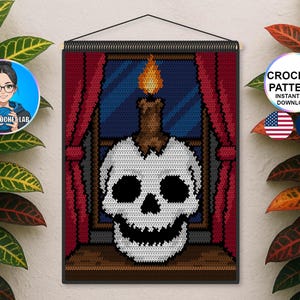 May include: A crochet wall hanging featuring a skull with a lit candle in a window scene. The design includes red curtains, a blue window, and a brown windowsill. The text "CROCHET PATTERN" is visible.