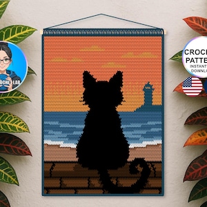 May include: Crocheted wall hanging featuring a black cat silhouette overlooking a seascape with a lighthouse. The background depicts a sunset with orange and blue hues. The text "CROCHET PATTERN INSTANT PDF DOWNLOAD" is visible.