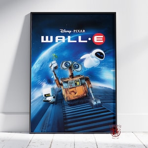 May include: Framed poster of the Disney Pixar film "WALL-E." The image shows the robot WALL-E holding a plant, with the robot EVE and the film's title in white against a blue space backdrop. The poster is presented in a black frame.
