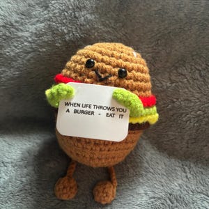 Crocheted burger with sign