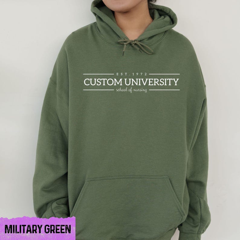 a young man wearing a green hoodie with the words custom university printed on it