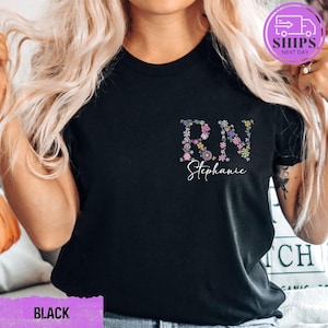 a woman with blonde hair wearing a black t - shirt