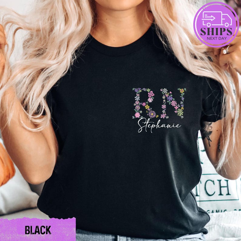 a woman with blonde hair wearing a black t - shirt