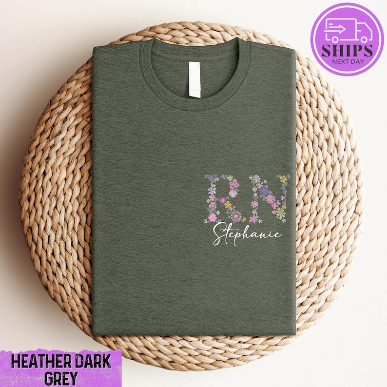 a green t - shirt with a floral design on it