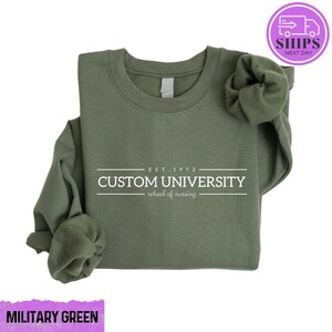 a military green shirt with the words custom university printed on it