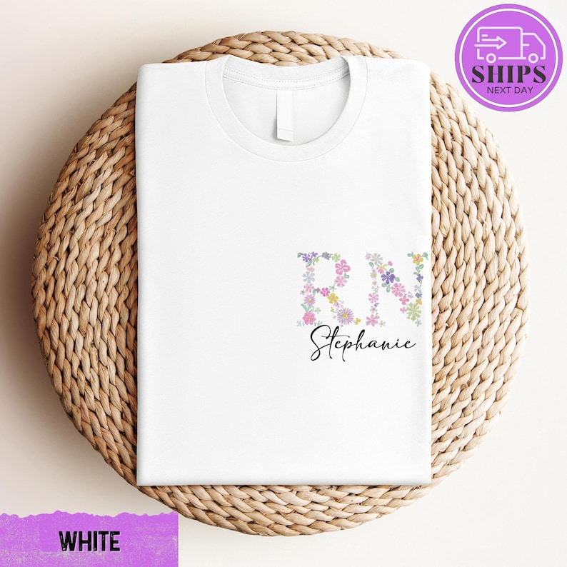 a white t - shirt with a floral design on it