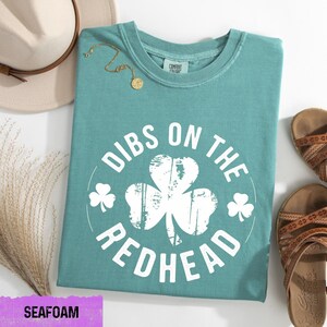 a t - shirt that says dubs on the redhead with a shamrock on it
