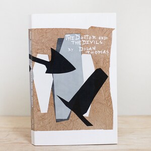 May include: Book cover with a white background and a brown, textured paper overlay. The title "The Doctor and the Devils" is written in white with the author "Dylan Thomas" below. The cover features a black and white abstract design with a coffin shape.