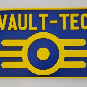 May include: A yellow and blue sign with the text "VAULT-TEC" and a stylized yellow Vault-Tec logo.