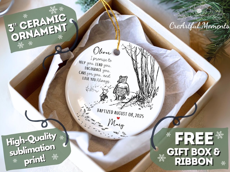 May include: A 7.6 cm ceramic ornament with a black and white illustration of Winnie the Pooh and Piglet. The ornament has the text "I promise to help you..." and is presented in a gift box with a ribbon.