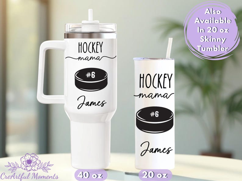 May include: Two white tumblers with black text and graphics. The larger tumbler has a handle and holds 40 oz. The smaller tumbler holds 20 oz. Both say "HOCKEY mama" with a hockey puck graphic and the name "James".