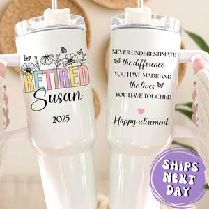 May include: White insulated tumbler with a floral design and the text "RETIRED Susan 2025". The other tumbler has the text "NEVER UNDERESTIMATE the difference you have made and the lives you have touched. Happy retirement".