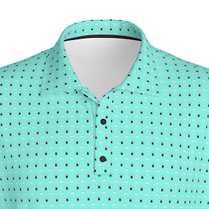May include: A turquoise polo shirt with a repeating pattern of bowling pins and balls. The shirt has a black collar and black buttons.