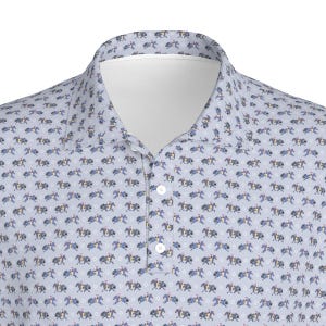 May include: Light blue polo shirt with a repeating pattern of riders on horseback. The shirt has a white collar and a three-button placket. The equestrian-themed design features riders in blue and yellow on white horses.