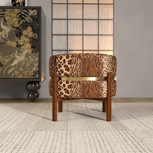 a leopard print armchair placed on a white rug in a room with a large window and a decorative cabinet.