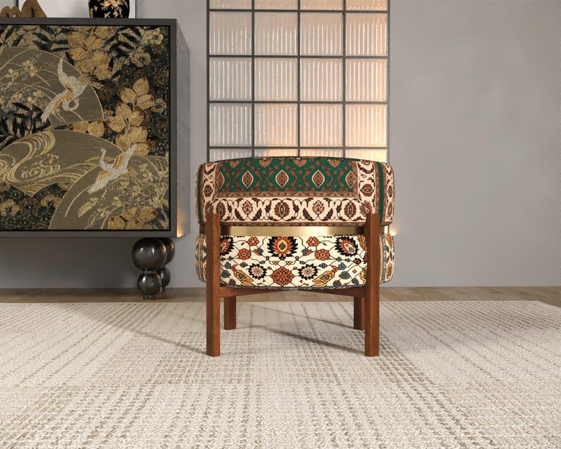 a colorful, patterned chair with a wooden frame, placed on a white rug in a minimalist setting.