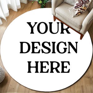 May include: White round rug with the text "YOUR DESIGN HERE" printed in black.