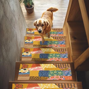 May include: A golden retriever dog walks down a wooden staircase with colorful, patterned stair treads. The treads feature a patchwork design with butterflies, floral, and animal print motifs in yellow, blue, and pink.