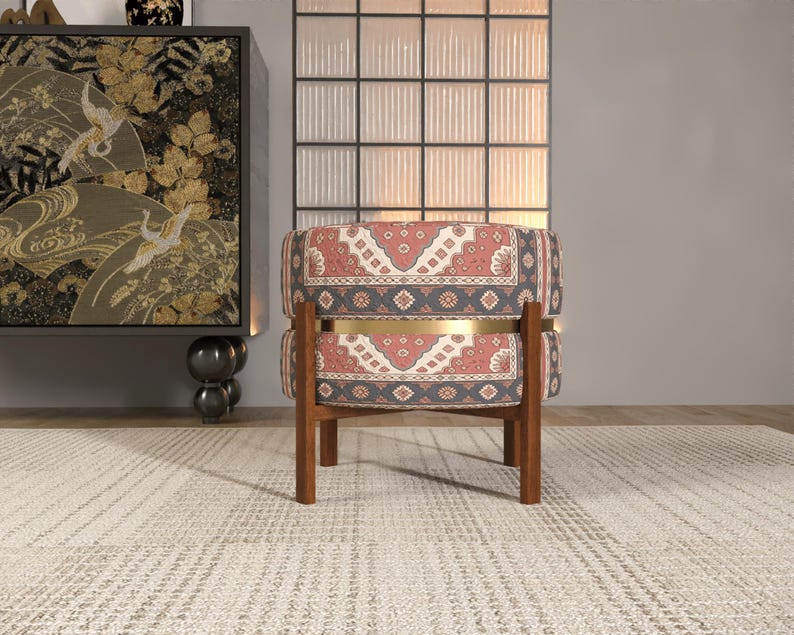 a modern living room with a patterned chair, a decorative cabinet, and a large window with a white frame.