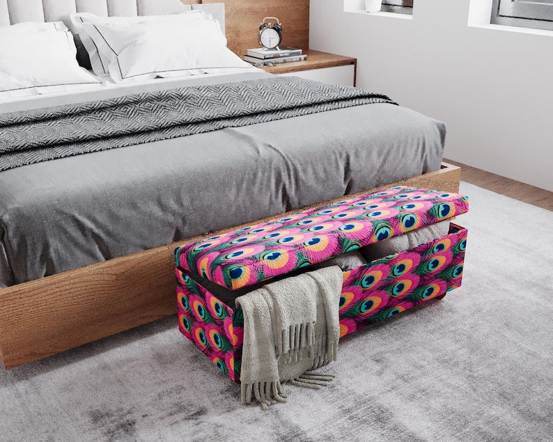 a bedroom with a bed, a wooden headboard, and a colorful storage box with a patterned design on the floor.