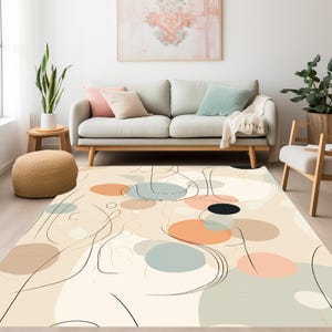 Könnte beinhalten: Abstrakter Teppich mit cremefarbenem Hintergrund und einem Muster aus überlappenden Kreisen in Beige-, Pfirsich-, Blaugrün- und Schwarztönen. Die Kreise sind mit schwarzer Farbe umrandet und durch dünne schwarze Linien verbunden.