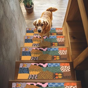 May include: A golden retriever dog walks down a wooden staircase with colorful, patterned stair treads. The treads feature a patchwork design with butterfly and animal print motifs in shades of orange, blue, and brown.