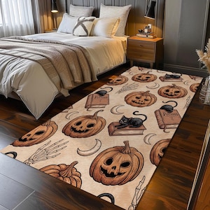 May include: A rectangular Halloween-themed rug featuring a repeating pattern of jack-o'-lanterns, black cats, books, crescent moons, and skeletal hands. The rug has a beige background with brown and black illustrations.