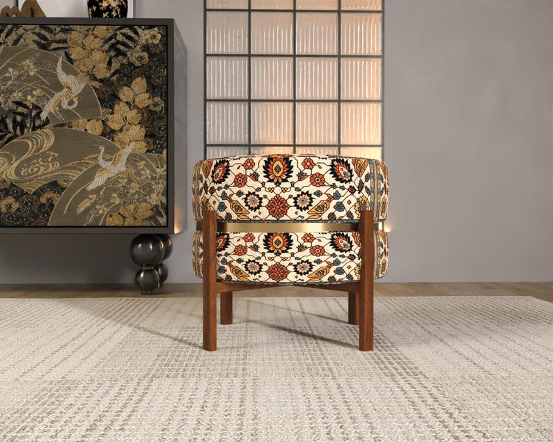 a modern living room with a round, patterned chair in the center, a large wall with a decorative panel, and a rug on the floor.