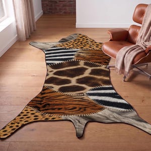 May include: An irregular shaped area rug featuring a patchwork design of various animal print patterns including giraffe spots, zebra stripes, tiger stripes, and leopard spots, all joined together with visible white stitched detailing.