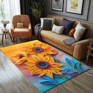 Puede incluir: Una alfombra de área colorida con un diseño de tres grandes girasoles amarillos con acentos azules y morados. Los girasoles están superpuestos y parecen estar hechos de papel.