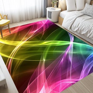 Könnte beinhalten: Abstrakter Teppich mit einem farbenfrohen Design aus überlappenden, fließenden Linien in den Farben Pink, Lila, Blau, Grün und Gelb auf einem dunklen Hintergrund.