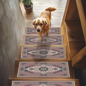 May include: A golden retriever dog walks down a wooden staircase with decorative stair treads. The treads feature a repeating geometric pattern in shades of pink, blue, and cream, adding a touch of elegance to the home.