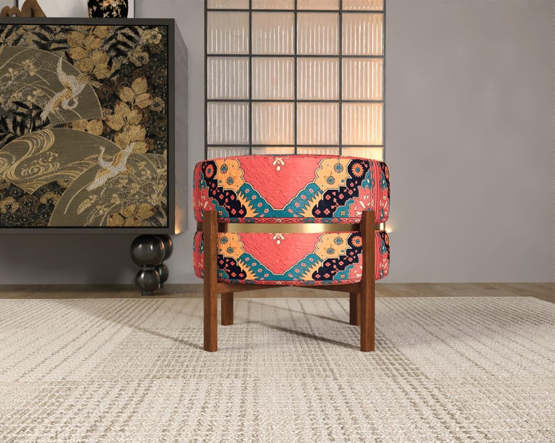 a vibrant, patterned chair with a wooden frame, placed on a white rug in a minimalist setting.