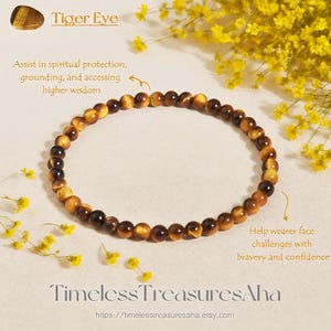 May include: A Tiger Eye beaded bracelet. The bracelet is made of small, round, brown and gold beads. The image includes text that reads "Tiger Eye", "Assist in spiritual protection, grounding, and accessing higher wisdom", and "Help wearer face challenges with bravery and confidence".