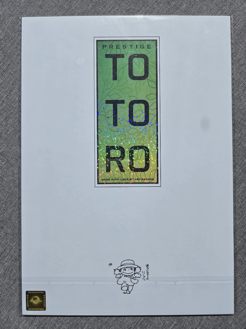May include: A white card with a green and holographic design that reads "TO TO RO" in large letters. The word "PRESTIGE" is at the top. A small illustration of a character is at the bottom.