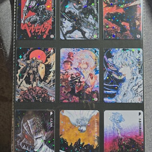 May include: Nine trading cards featuring illustrations of characters from the Berserk manga series. The cards are in a binder, with vibrant colors and holographic accents. Each card has Japanese text and a unique design.