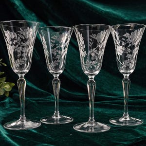 May include: A set of three ceramic mugs with a speckled, matte finish. The mugs are in shades of cream, light gray, and dark gray. Each mug has a simple, minimalist design and a rounded handle. The mugs are likely for coffee or tea.