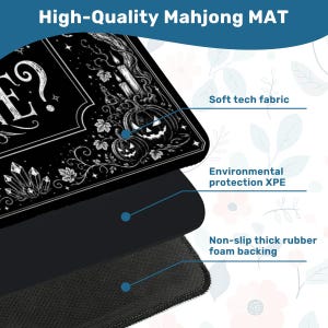 May include: Black and white Mahjong mat with a Halloween theme. The mat features a decorative border with pumpkins, candles, and crystals. The text "High-Quality Mahjong MAT" is at the top. It has a soft tech fabric, environmental protection XPE, and non-slip thick rubber foam backing.