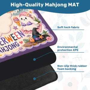 May include: A rectangular mahjong mat featuring a cartoon ghost wearing a pink cap and bikini, holding an ice cream cone. The design includes a black witch hat, a surfboard, and the text "ERWEEN AHJONG". It has a soft fabric top, an XPE layer, and a black non-slip rubber foam backing.
