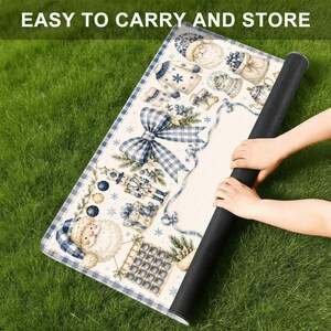 May include: A rectangular mat featuring a festive blue and white Christmas pattern with illustrations of Santa Claus, a nutcracker, a large plaid bow, snowflakes, and gifts. The text EASY TO CARRY AND STORE is printed at the top of the image.