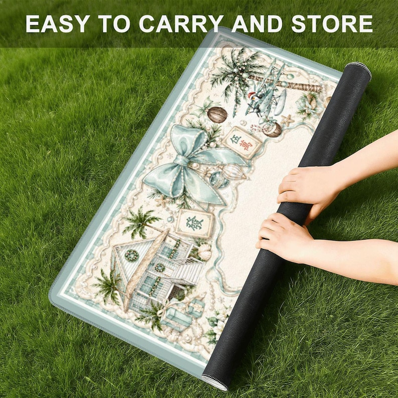 May include: A rolled-up rectangular mat with a detailed, pastel-colored design featuring a beach scene, palm trees, and a large bow. The mat is being rolled up, revealing a black underside. Text at the top reads "EASY TO CARRY AND STORE".