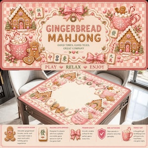 May include: A pink and white Gingerbread Mahjong game set. The game mat features gingerbread houses, bows, and mugs of hot cocoa. The text on the mat reads "Gingerbread Mahjong" and "Play, Relax, Enjoy."