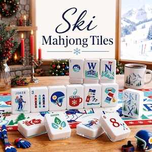 May include: A set of white rectangular Mahjong tiles featuring colorful illustrations of ski-themed icons, including skiers, mountains, mugs, and winter gear. The tiles display numbers and text like 'JOKER', 'GREEN', and 'SKI' in blue and red ink.